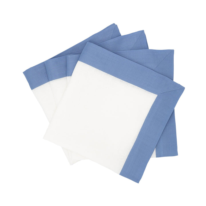 Linen napkin set of 4 with sky-blue double-sided borders and white center, folded squares