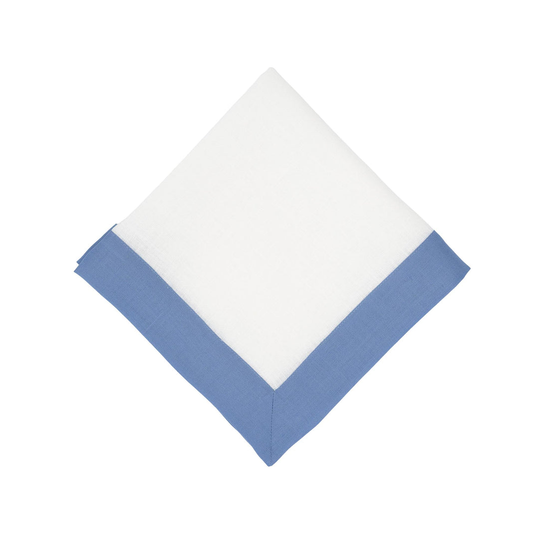 Single linen napkin with sky-blue border on two sides and white center, folded square