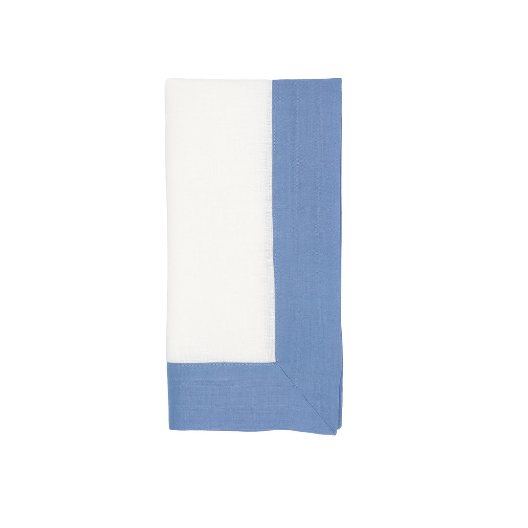 Linen napkin with white body and sky-blue side borders, folded and angled