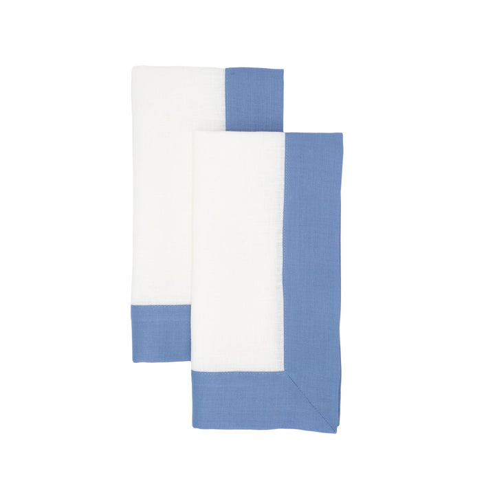Set of linen napkins with white fronts and sky-blue double borders, folded stacked view