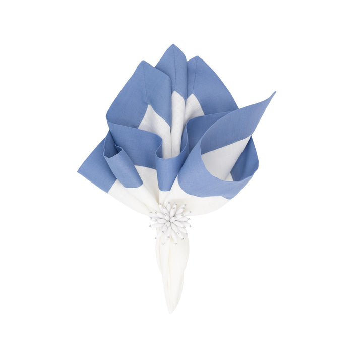 Folded linen napkin arrangement with sky-blue border stripes and white centers, flower tie detail