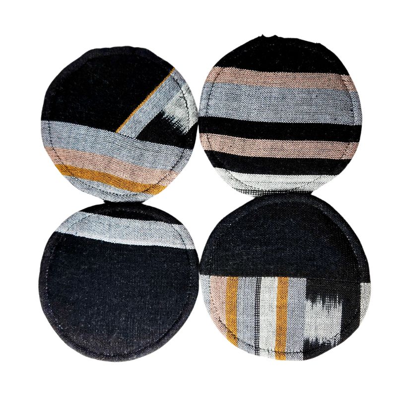 Circular woven coasters, four dark round designs with gray stripes and tan bands