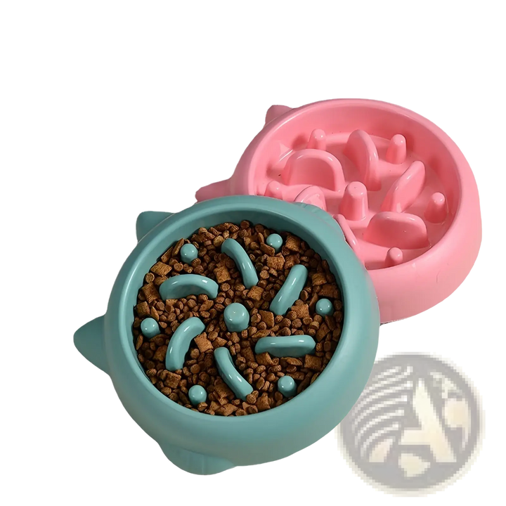 Teal and pink slow feeder silicone dog bowls filled with kibble