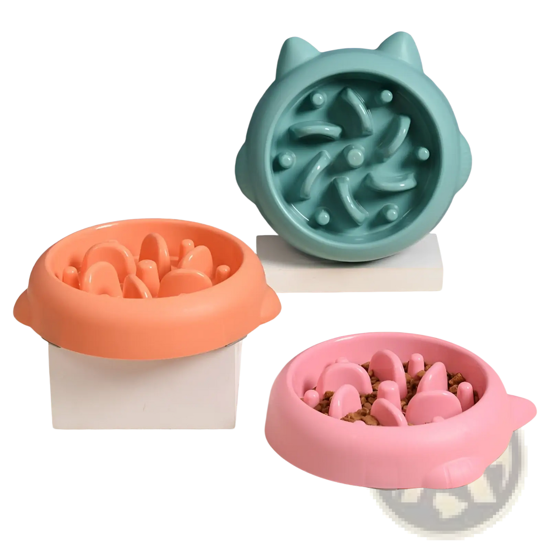 Slow feeder silicone dog bowls in teal, orange, and pink with anti-gulp ridges