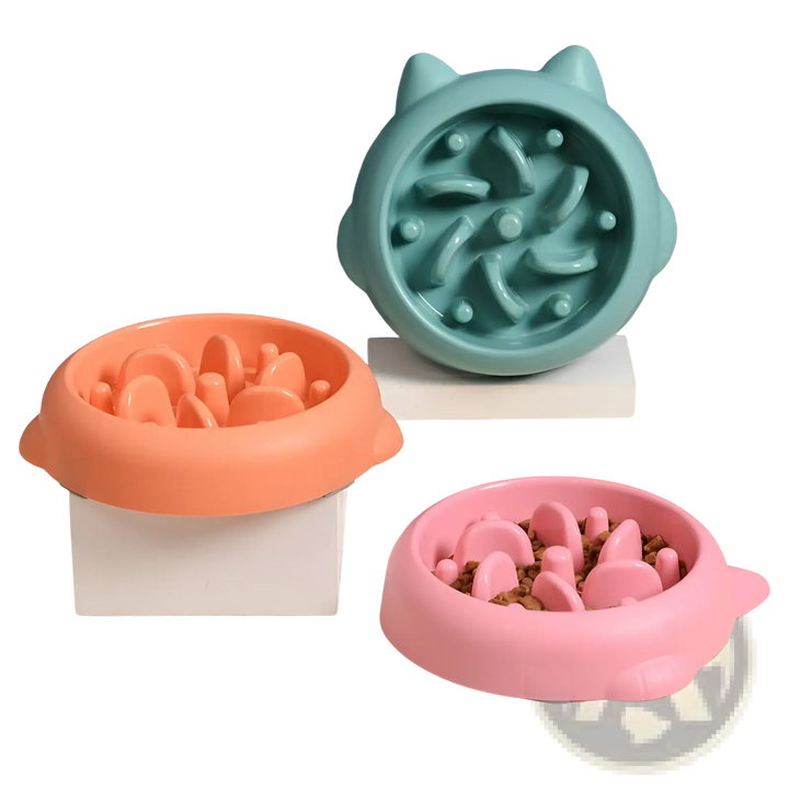 Slow feeder silicone dog bowls in teal, orange, and pink with anti-gulp ridges