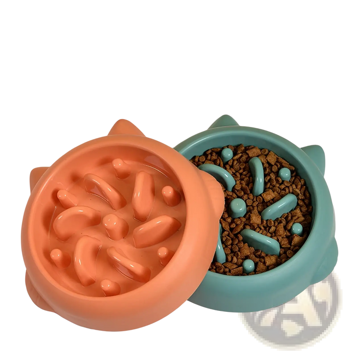 Slow feeder silicone dog bowl halves in teal and orange with kibble inside