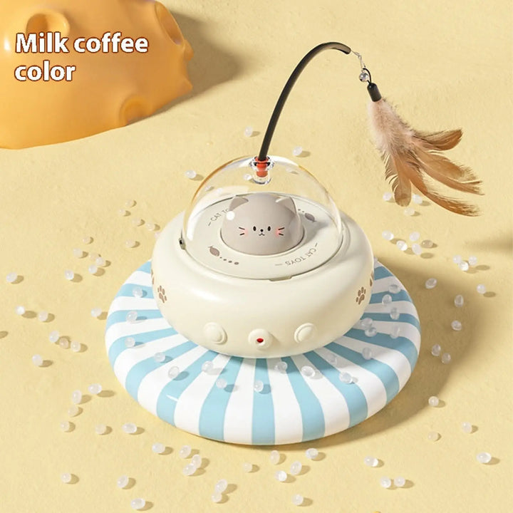 Cream UFO cat toy with bell feather wand and dome light, cat-face graphic