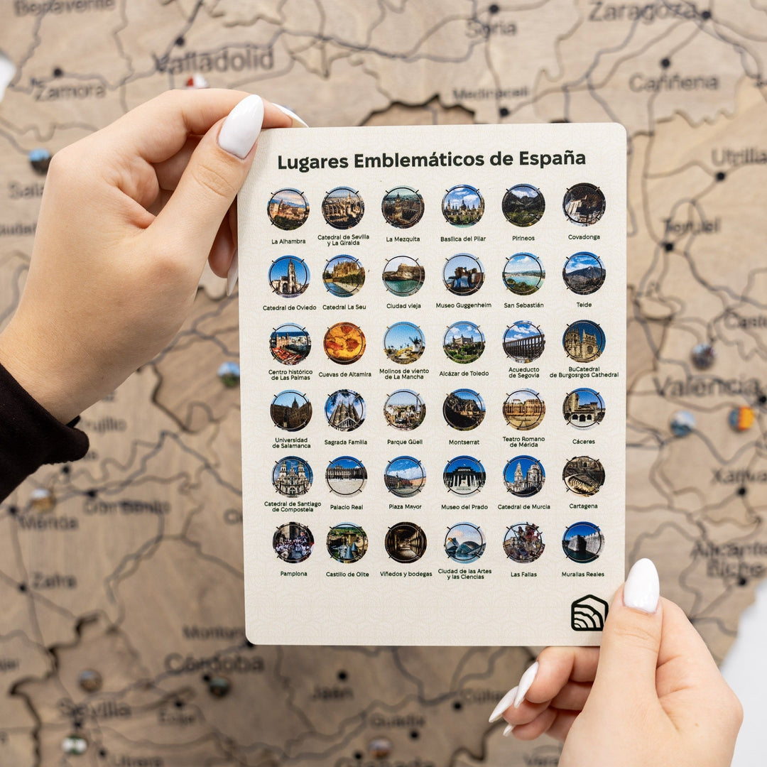 Spain landmark pin set on card, multiple round city and monument enamel pins, held by hands