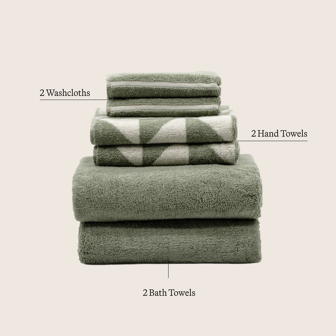 Sage green and ecru cotton towels stack: washcloths, hand towels, and bath towels