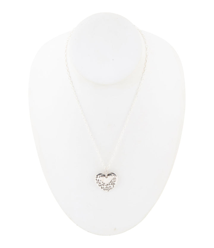 Sterling silver engraved heart pendant necklace on a mannequin bust