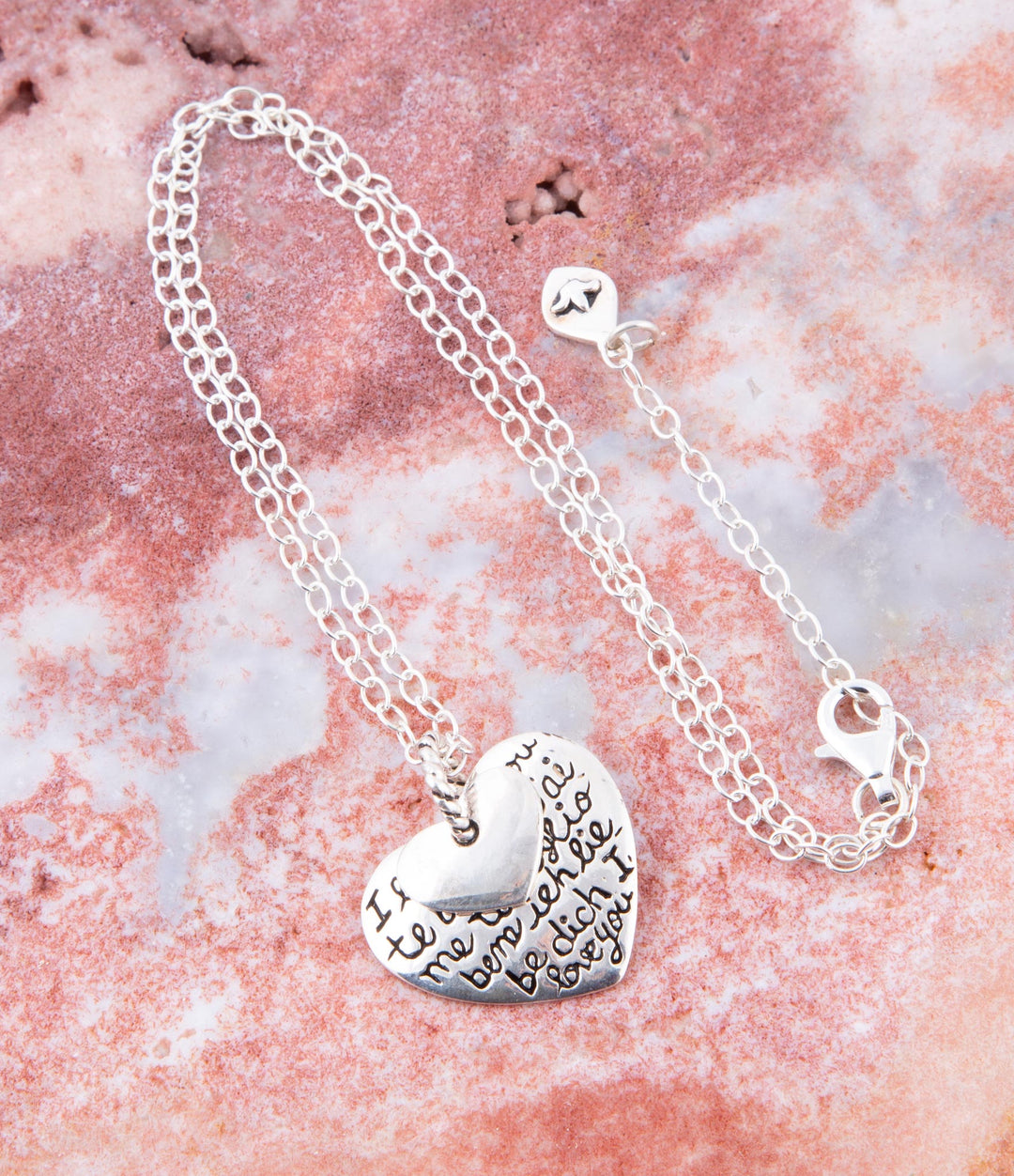 Sterling silver heart pendant with dark engraved lettering and linked chain