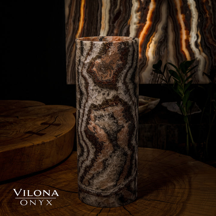 Dark onyx table lamp cylinder with amber glow lines and textured wavy stone pattern