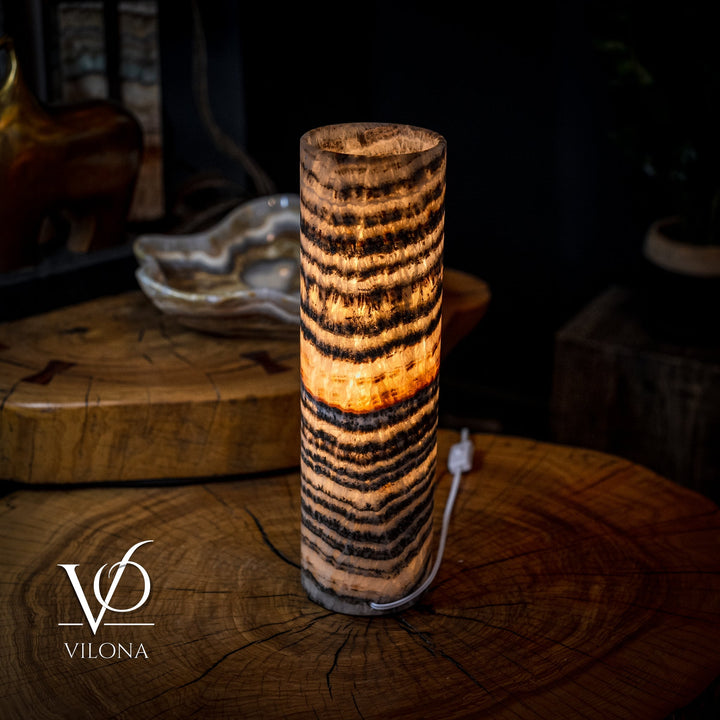 Onyx crystal table lamp, cylindrical with amber core glow and dark wavy stripes