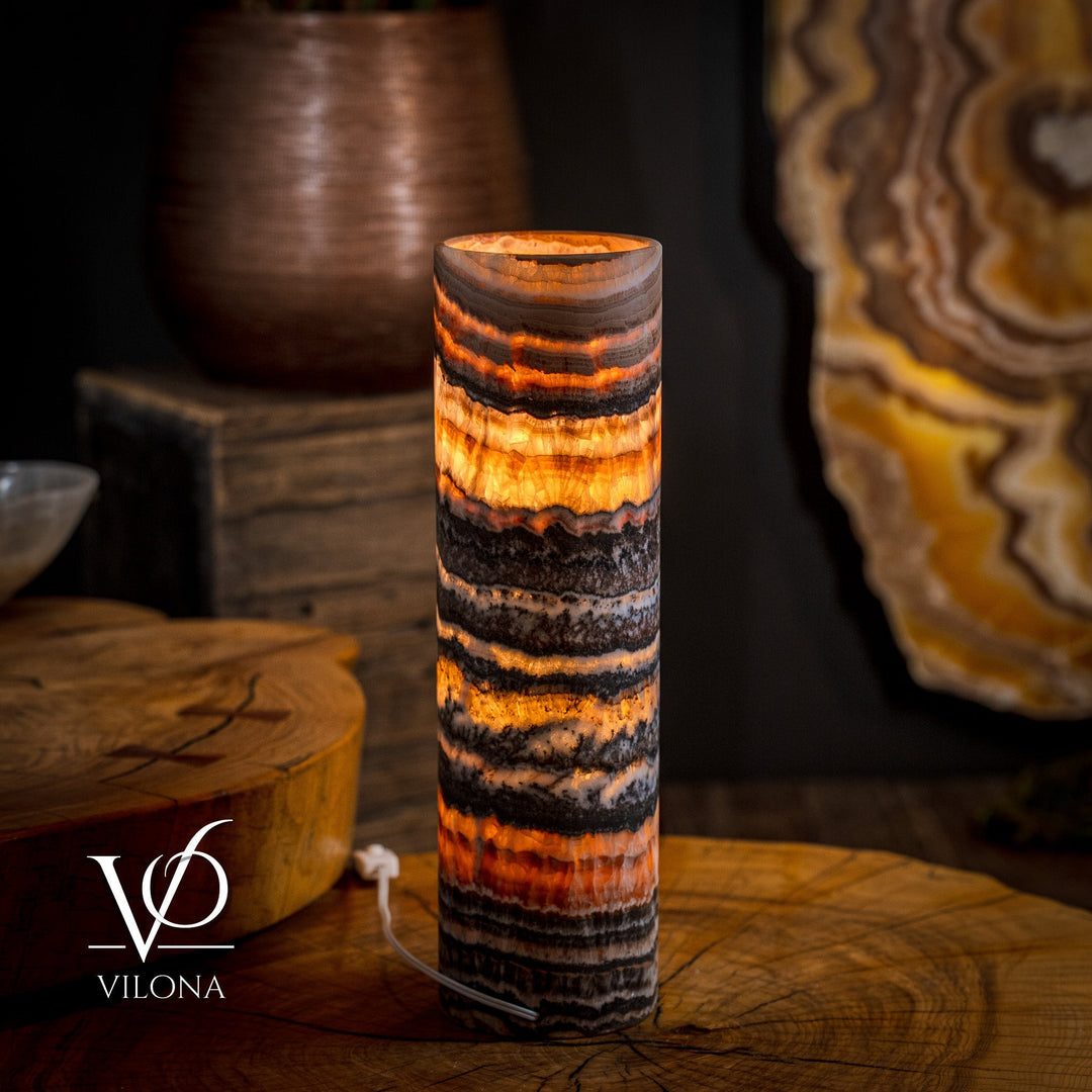 Tangerine crystal table lamp, tall onyx-striped column shade with warm glow