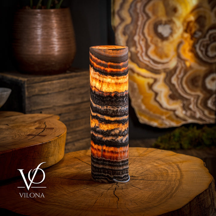 Tangerine crystal table lamp, glowing onyx-striped column shade with fiery orange bands