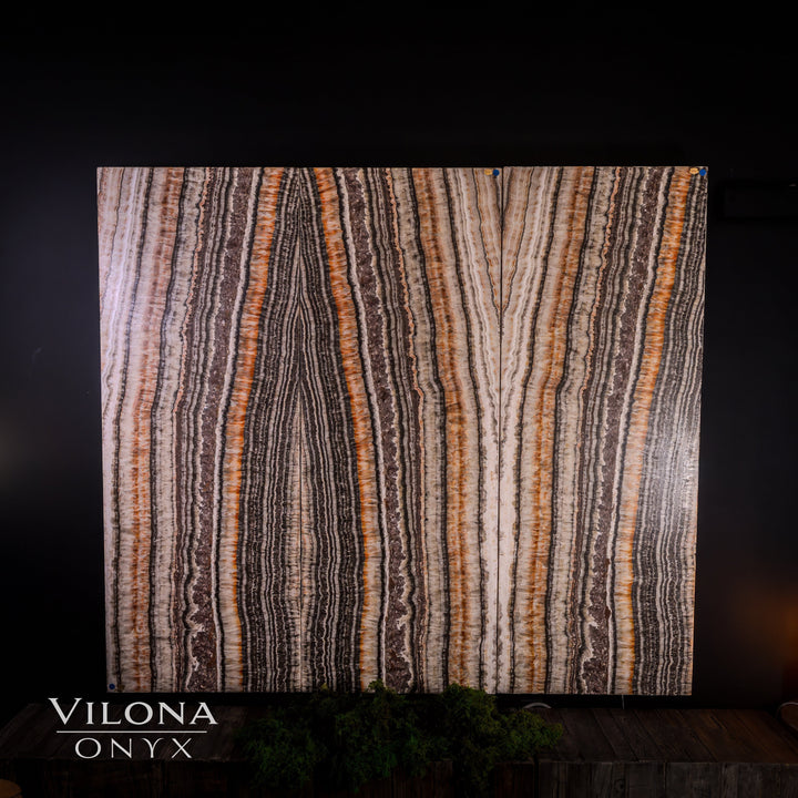 Striped onyx wall panel with cream and dark brown vertical veining
