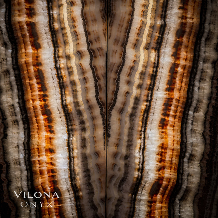 Tight view of onyx wall panel texture with orange amber stripes and dark lines