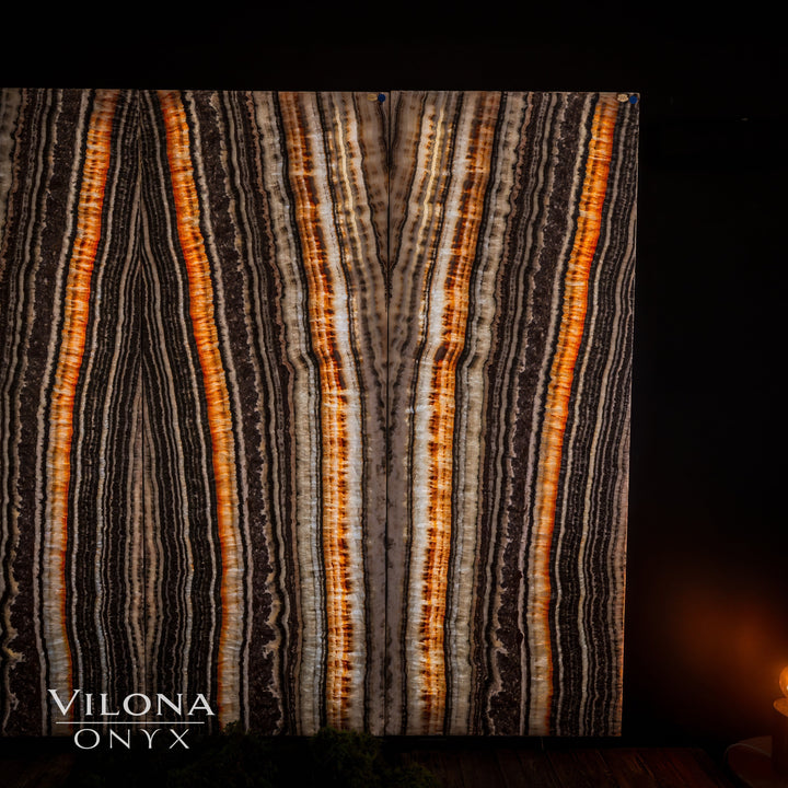 Wall panel with vertical orange-amber and cream striping over dark onyx pattern