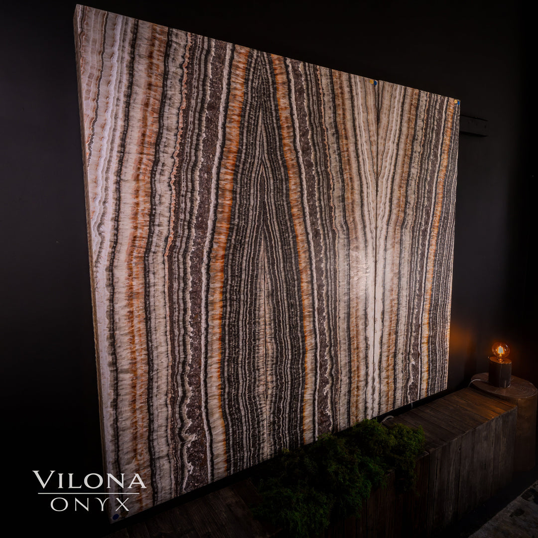 Striped onyx wall panel with mauve, gray, and cream vertical lines