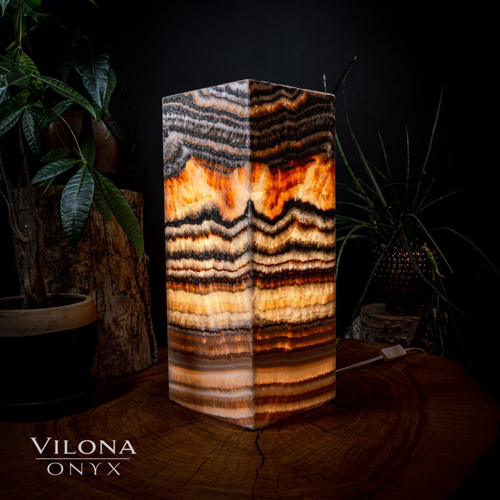Square table lamp with onyx-look stone shade in amber, black, and white stripes