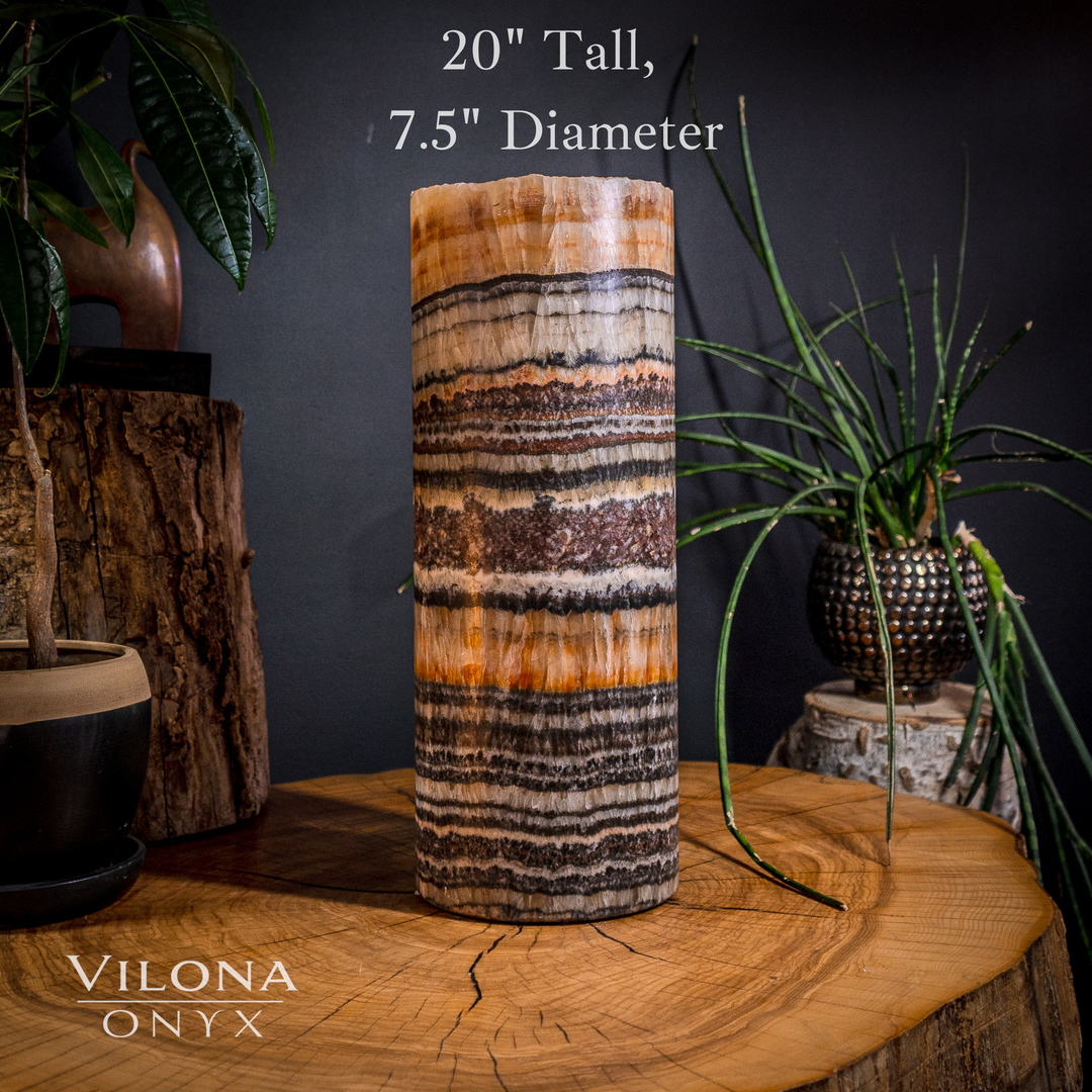 Medium table lamp, 20 in tall; cylindrical onyx shade with orange and black stripe pattern.