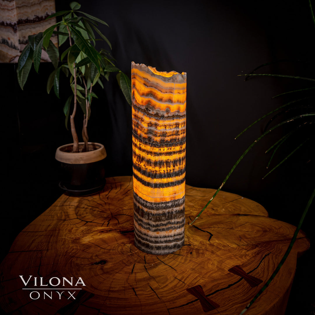 Onyx table lamp with vivid orange center stripes and dark charcoal banding