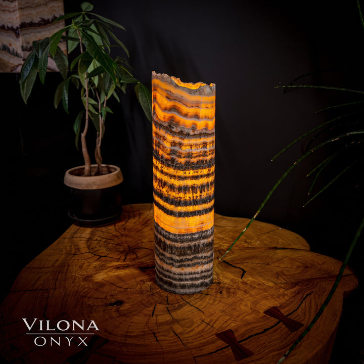 Onyx table lamp with vivid orange center stripes and dark charcoal banding