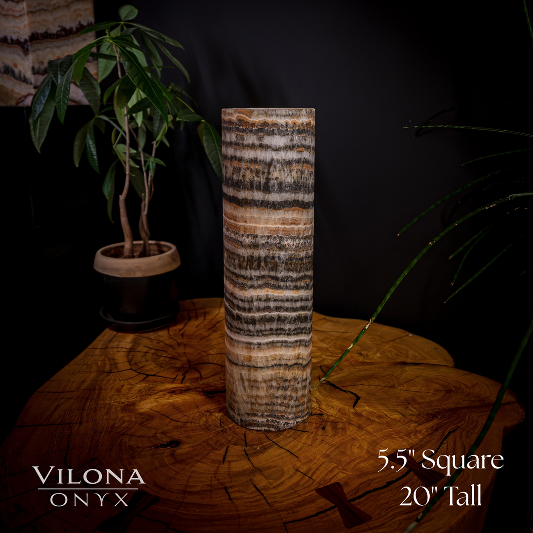 Cylindrical onyx table lamp, amber and black striped shade; 5" square, 20" tall.