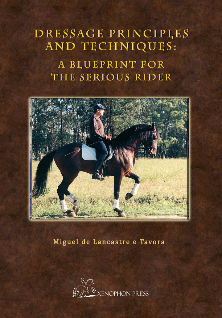 Dressage principles and techniques book cover with rider on dark horse in field