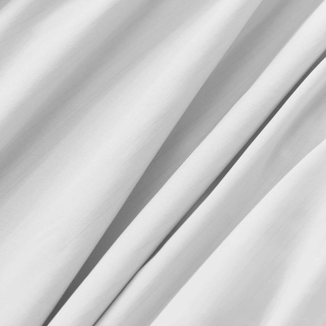 Close-up of white cooling sheet fabric with fine weave texture