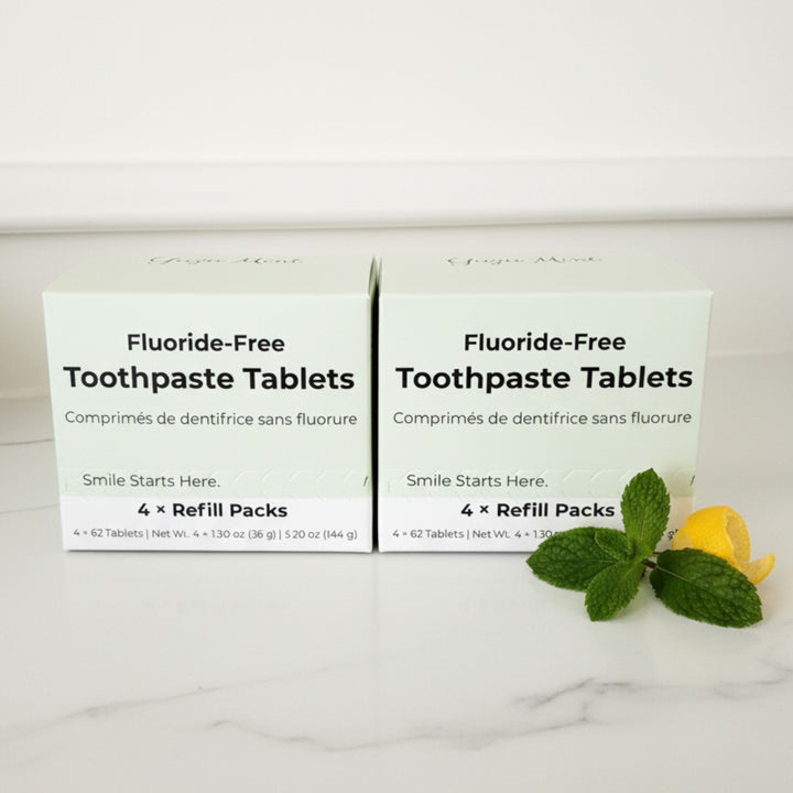Fluoride-free toothpaste tablet boxes with mint leaves and yuzu