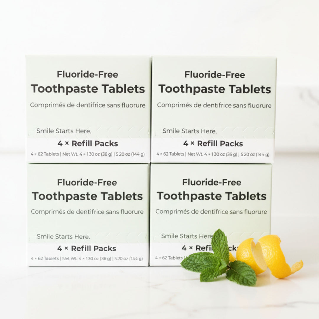 Fluoride-free toothpaste tablet refill boxes with mint leaves and citrus peel