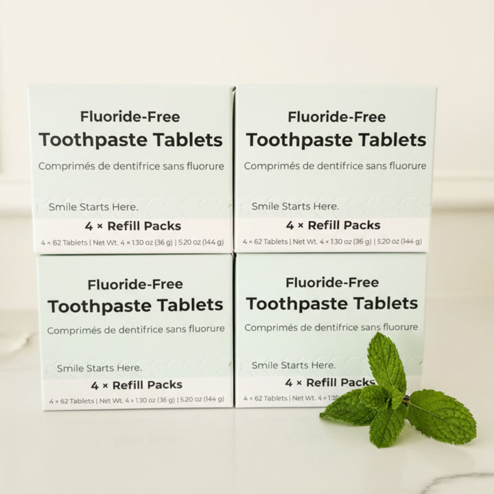 Toothpaste tablet refill boxes (fluoride-free), four-pack cartons displayed