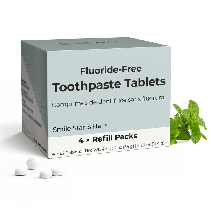 Fluoride-free toothpaste tablets box with four refill packs and loose white tablets