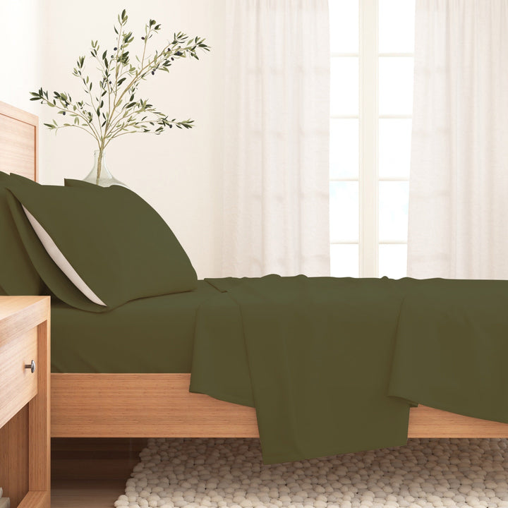Olive cotton flannel sheet set with pillow and flat sheet on a bed