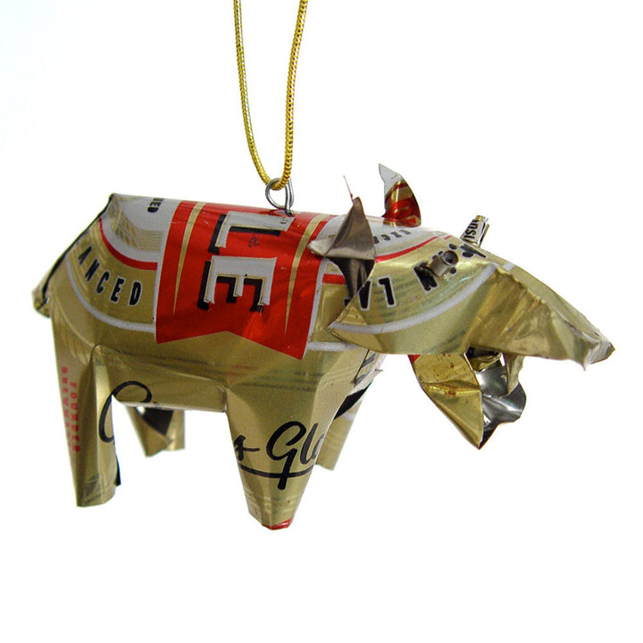 Gold tin hippo ornament with red label print, dangling on yellow-green cord.