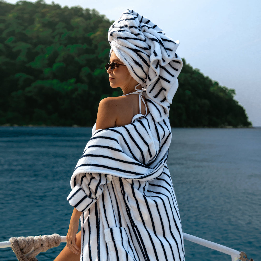 Unisex bathrobe with navy-and-white vertical stripes and cozy hood, belted waist