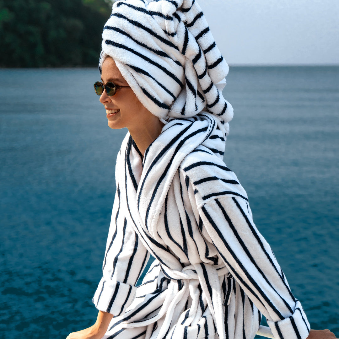 Unisex hooded bathrobe in navy-and-white vertical stripes with tie belt at waist
