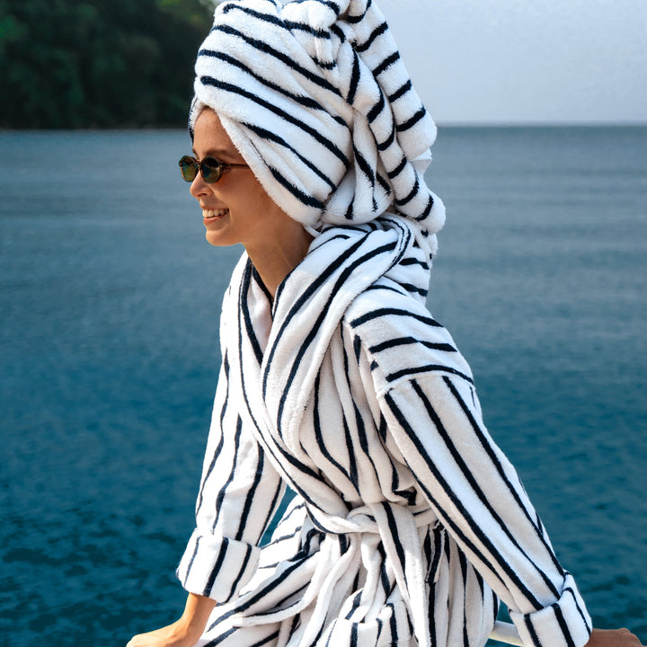 Unisex hooded bathrobe in navy-and-white vertical stripes with tie belt at waist