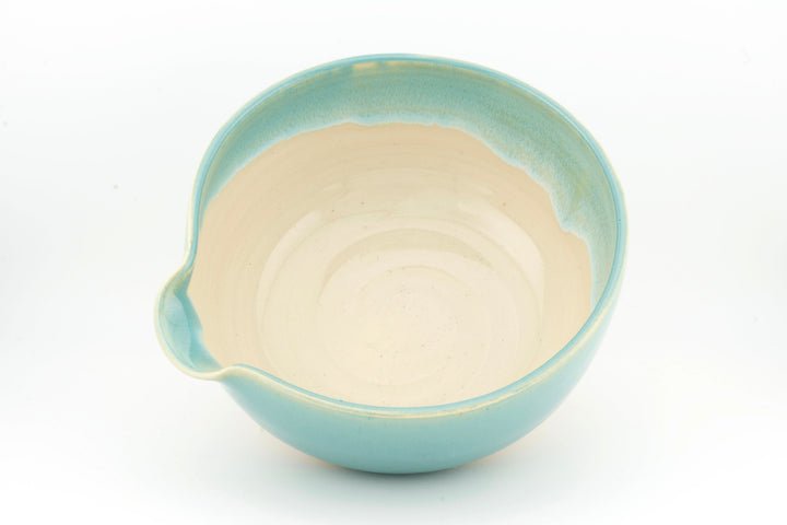 Ceramic bowl with optional spout, light turquoise body and cream interior