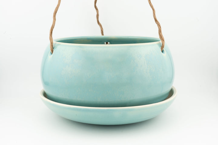 Light blue glazed hanging planter pot with rope handles and drain hole