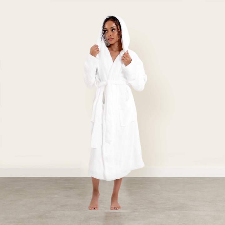 White plush hooded bathrobe with tie belt, full length and front patch pockets; front view.