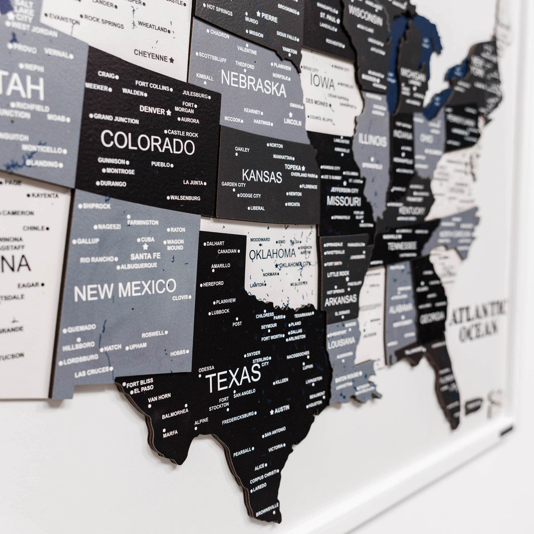 Close-up of 3D wooden USA map with raised state cutouts in dark and light finishes