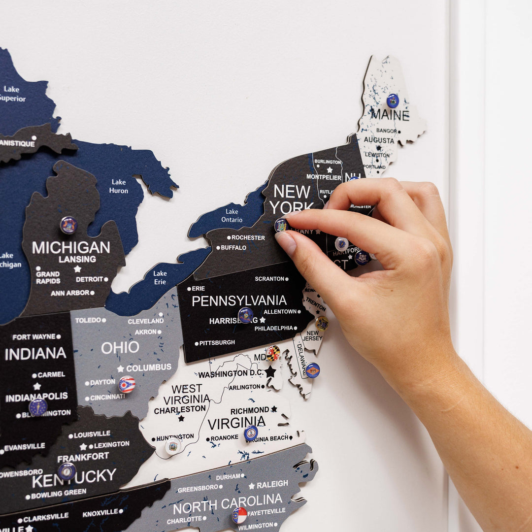 Close-up of 3D wooden USA map showing raised New York area with state labels