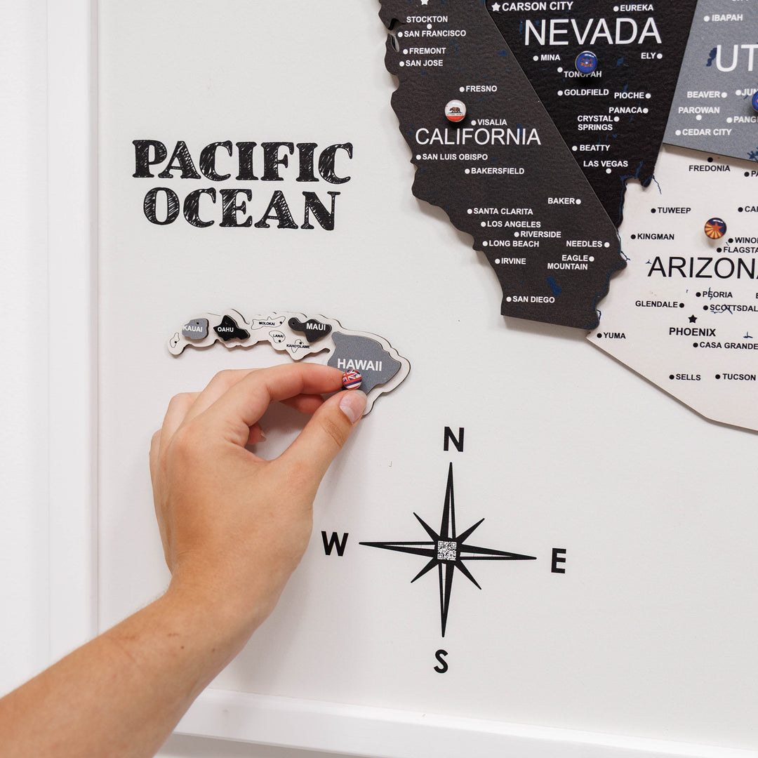 Close-up of 3D wooden USA map with Pacific Ocean text and raised island tile