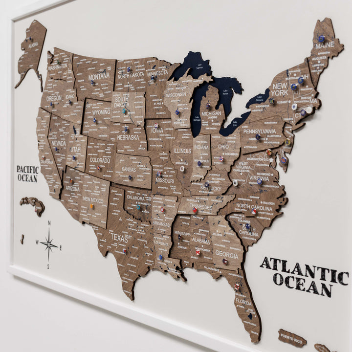 3D wooden USA map wall board close-up with state names and raised details