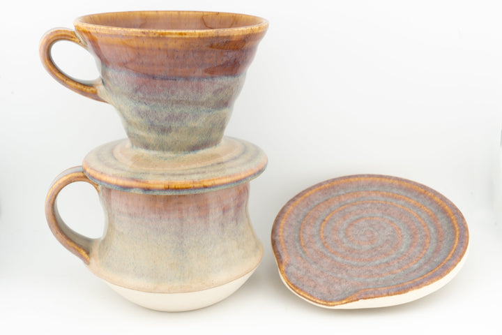Ceramic coffee mug set with coaster, two tall curvy mugs in tan and brown glaze