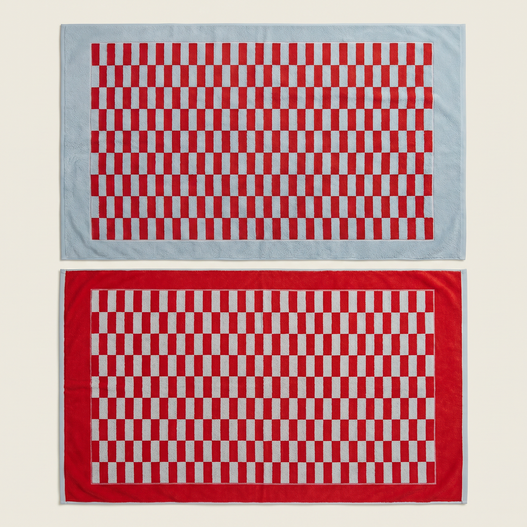 Red and white checkered cotton towels stacked, two folded pieces side by side.