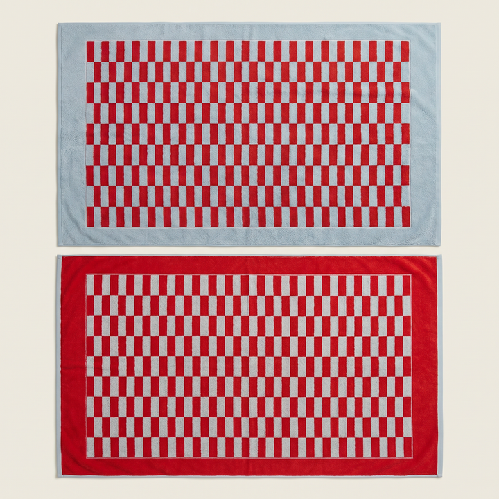 Red and white checkered cotton towels stacked, two folded pieces side by side.
