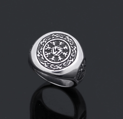 Polished stainless steel ring featuring circular Valknut emblem on front face